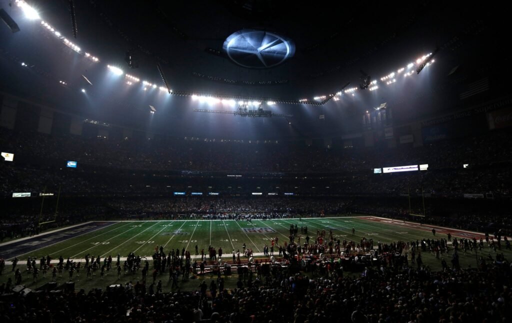 A stadium with a partial power outage during a night game.