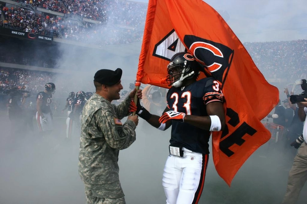 Fans waving Bears flags at Soldier Field.