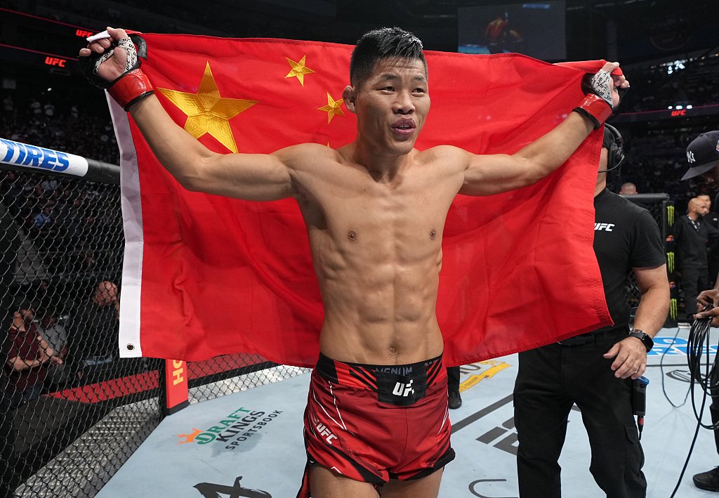 Li Jingliang celebrates after a knockout win.