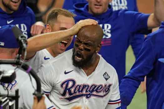 Garcia in the air, glove stretched toward the wall.