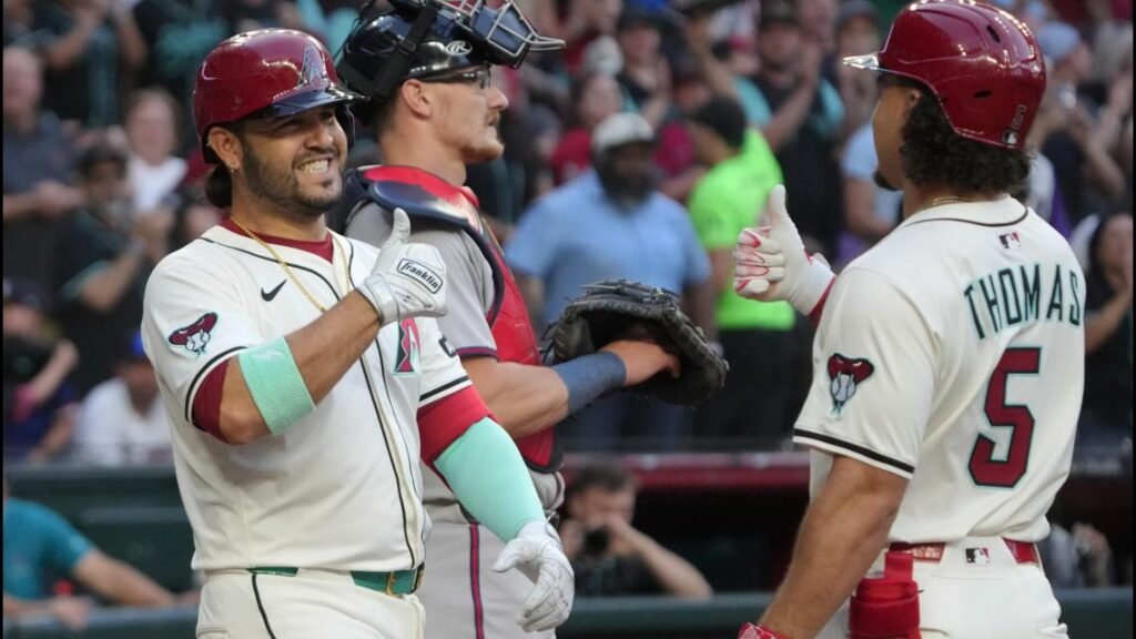 Eugenio Suarez celebrates after hitting his fourth home run in a single game.