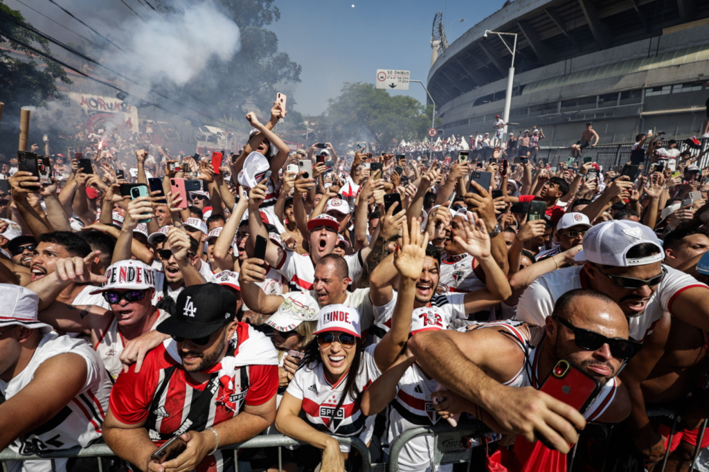 The crowd at Sao Paulo Stadium is waving banners for both the Chiefs and Chargers.