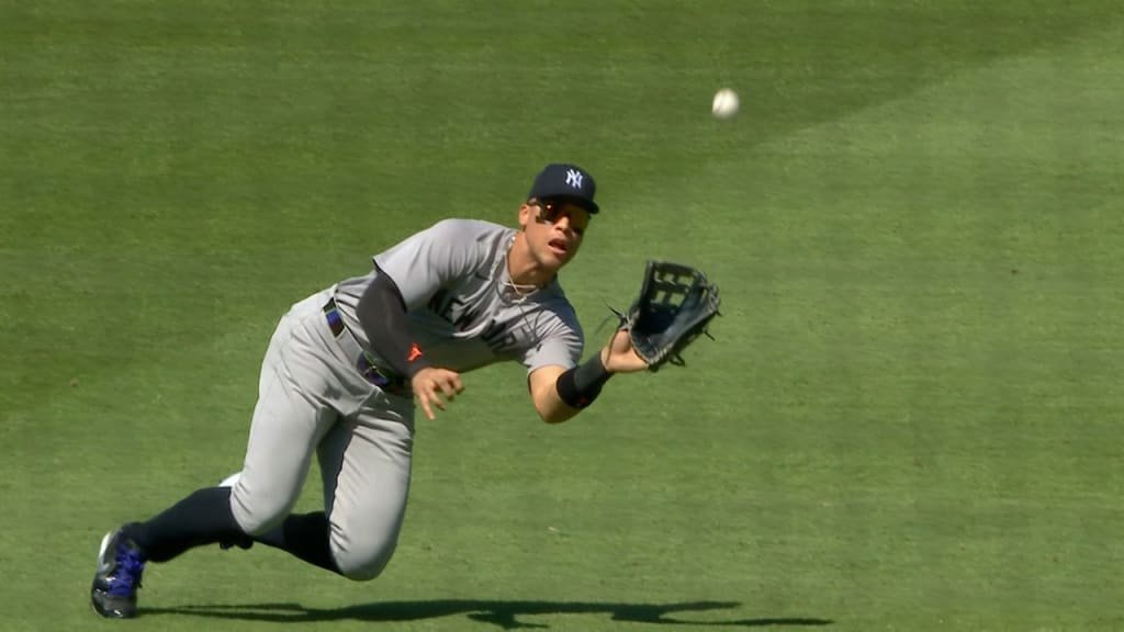 Bellinger dropping the throw, with the runner sliding to home base.
