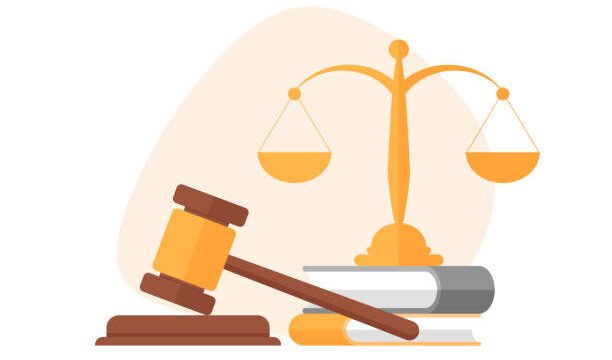 A hammer next to a football, which symbolizes discipline and punishment.