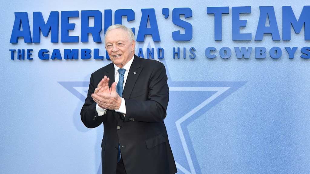 Jerry Jones on the Cowboys' sideline, Shining Star logo in the background.