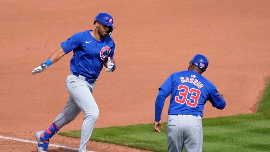 Davis is throwing on the run, the batter is sprinting toward first field.