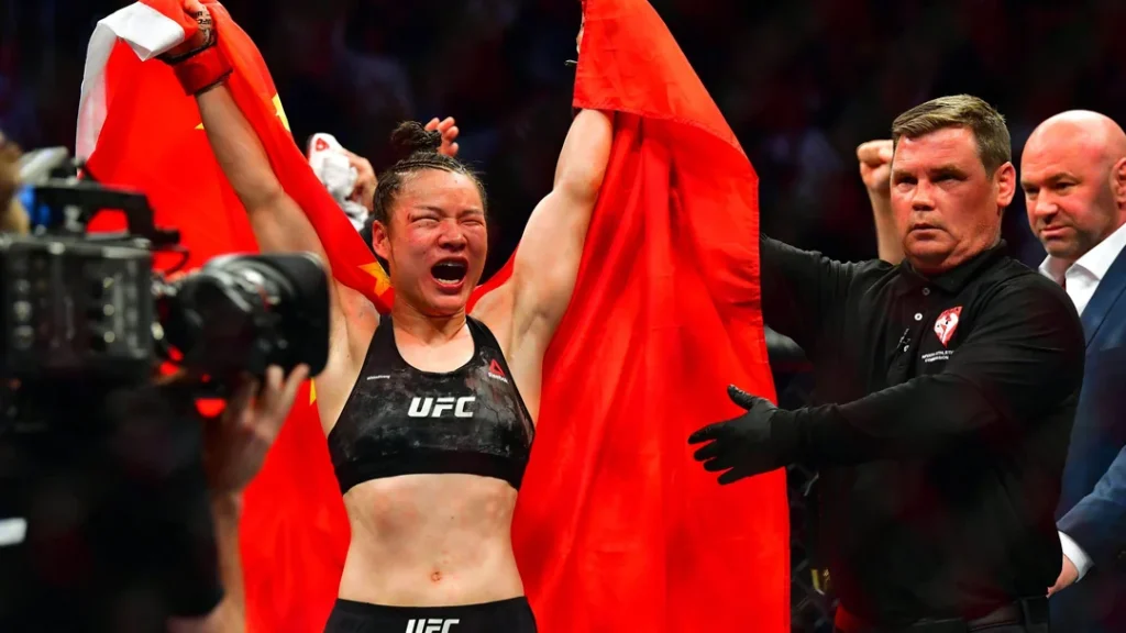 Zhang Weili holding her UFC belt, a symbol of Chinese MMA’s success.