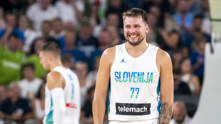 Luka cheers on his Slovenian teammates during a timeout.