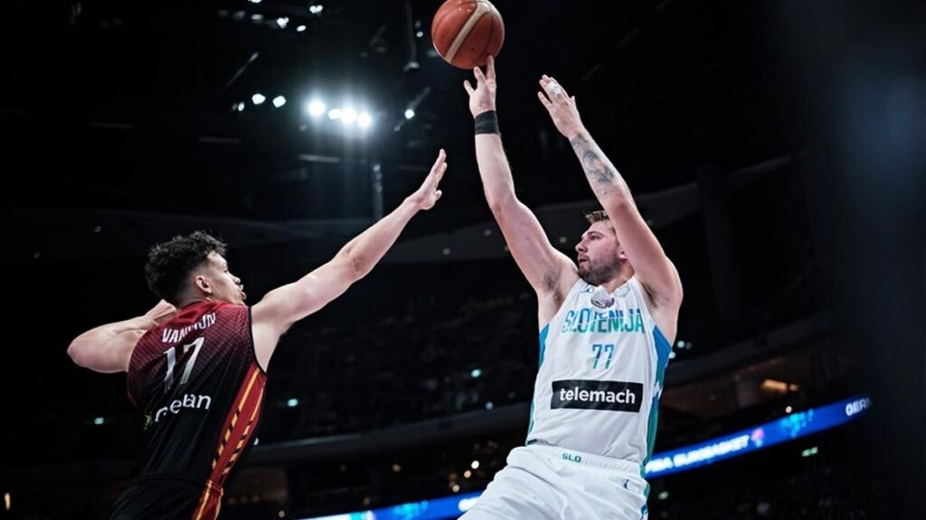 Slovenian players celebrate with Luka after their win over Belgium.